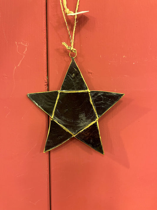 Ornament gemaakt van schelpen zwart